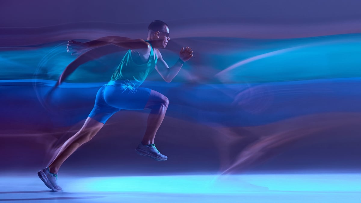 Runner captured in stylized long-exposure motion trail